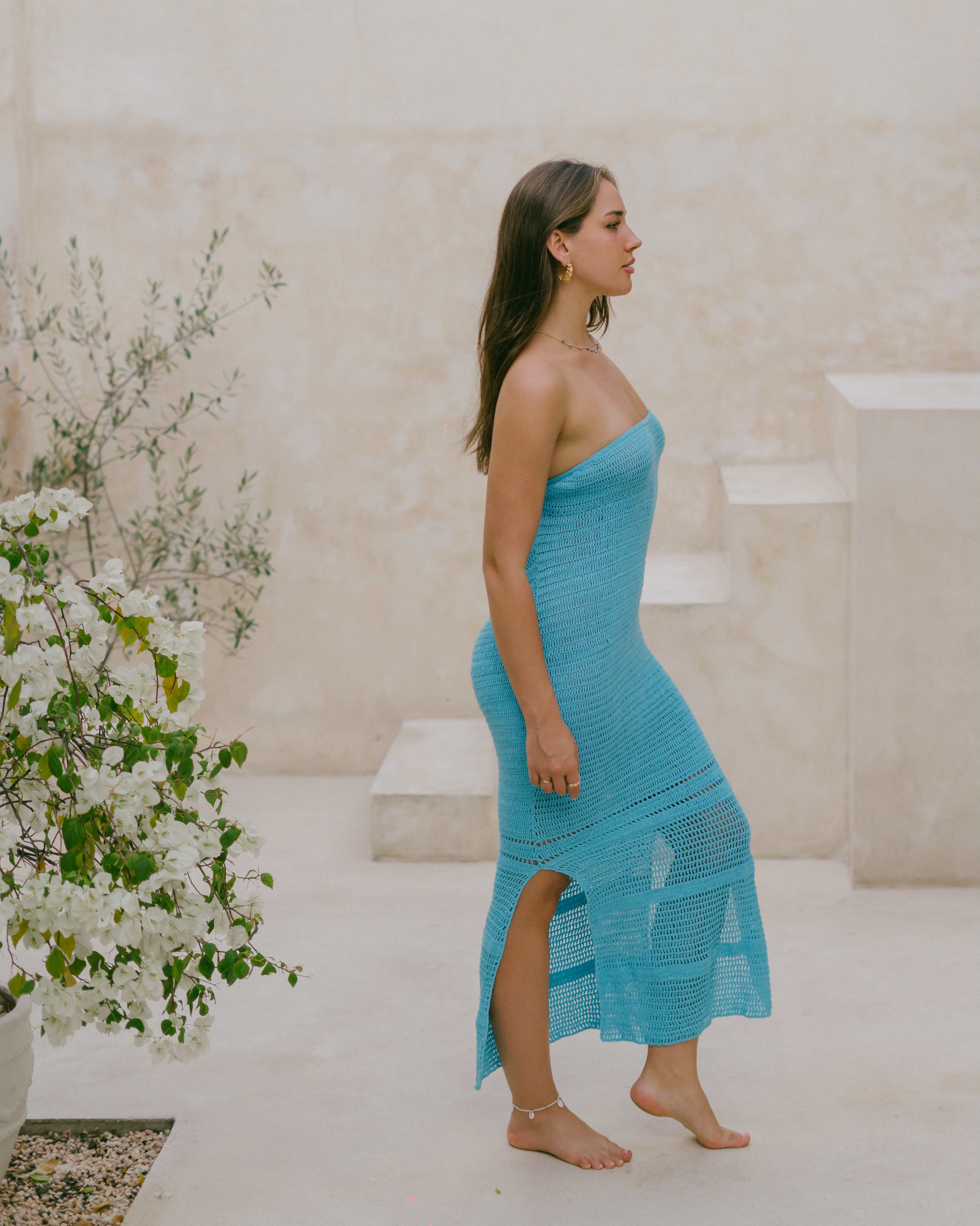 Elegant yet relaxed, the Azure Crochet Maxi Dress is a versatile summer staple with side slits, breathable crochet, and effortless flow.