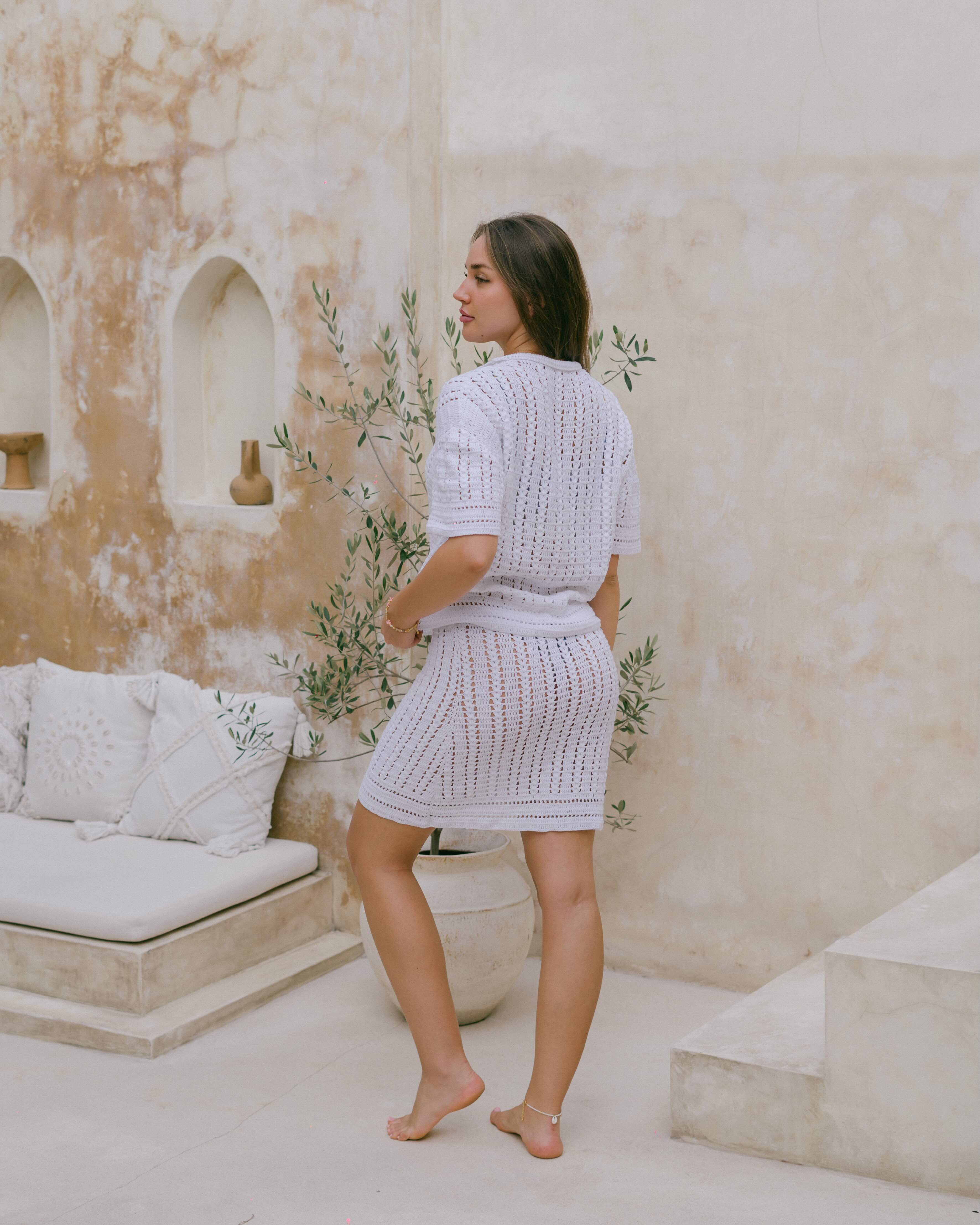 Designed in 100% cotton, the Nalu Crochet Shirt features a delicate crochet weave, relaxed fit, and elegant shell button details.