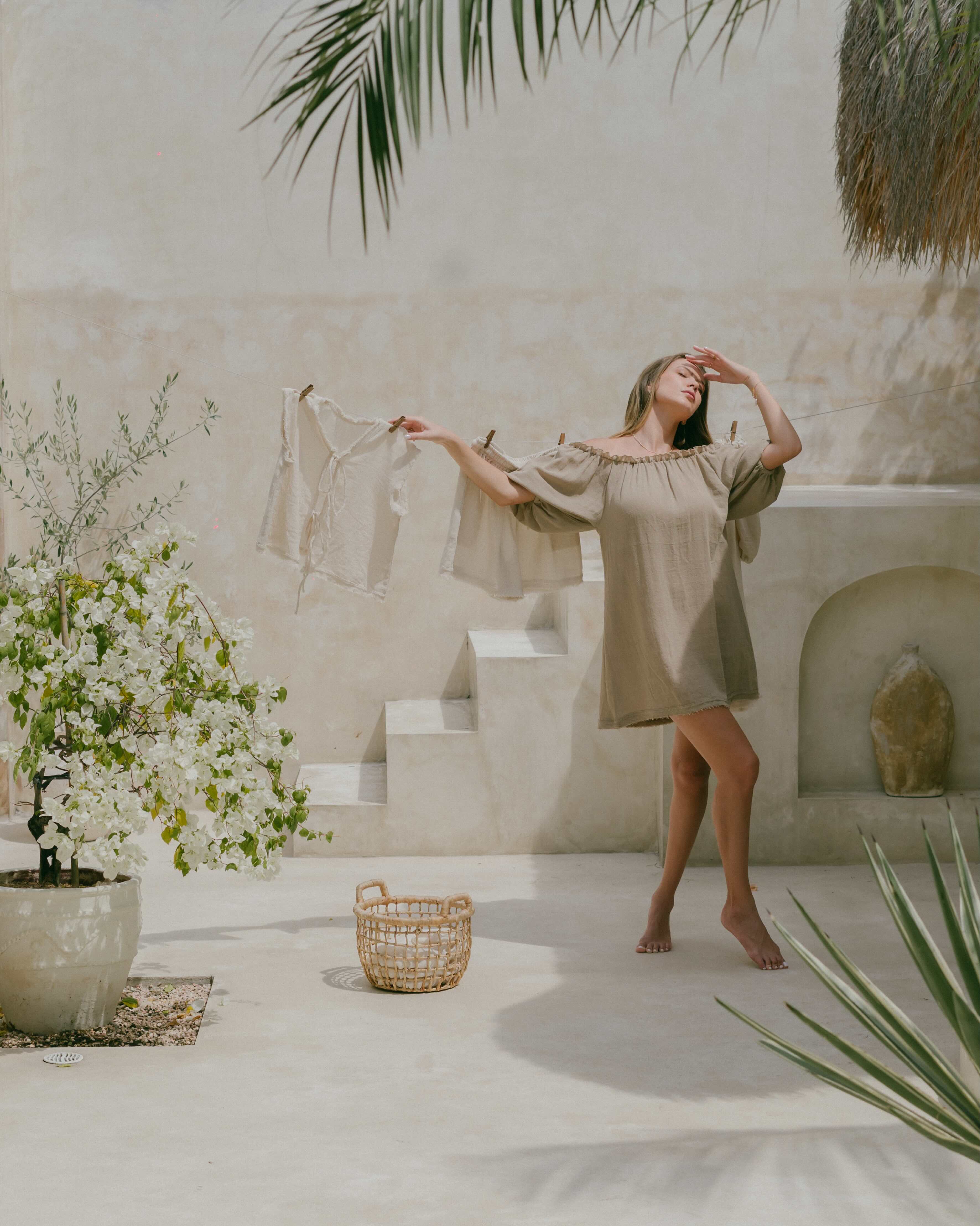 Romantic and relaxed, this ramie puff sleeve dress is a summer staple. Designed with a ruffle neckline, frayed hemline, and breathable double lining for all-day comfort.