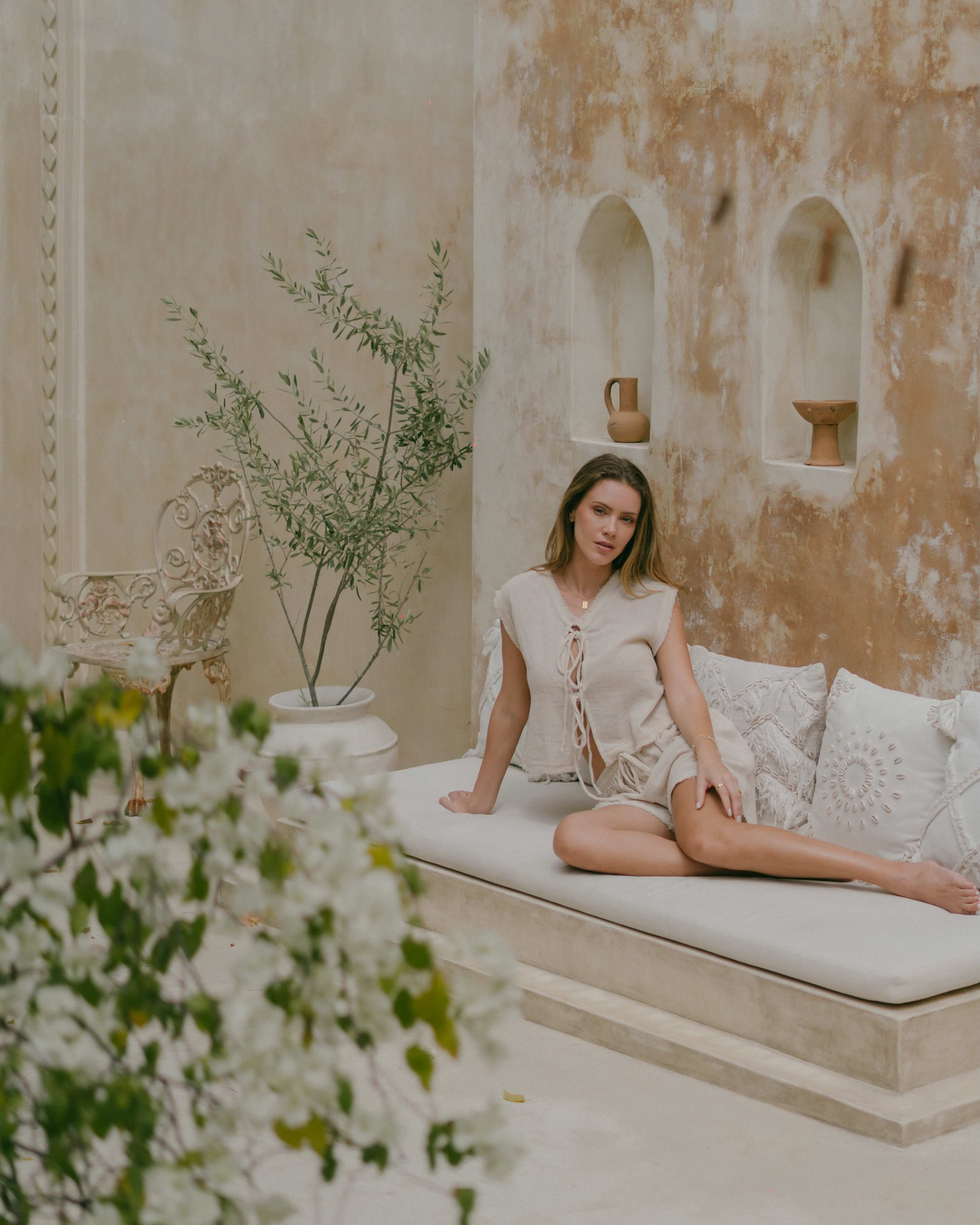 Frayed edge reversible top with two looks in one — tie-up front or rounded neckline. Relaxed, boxy fit makes it easy to style for any occasion.