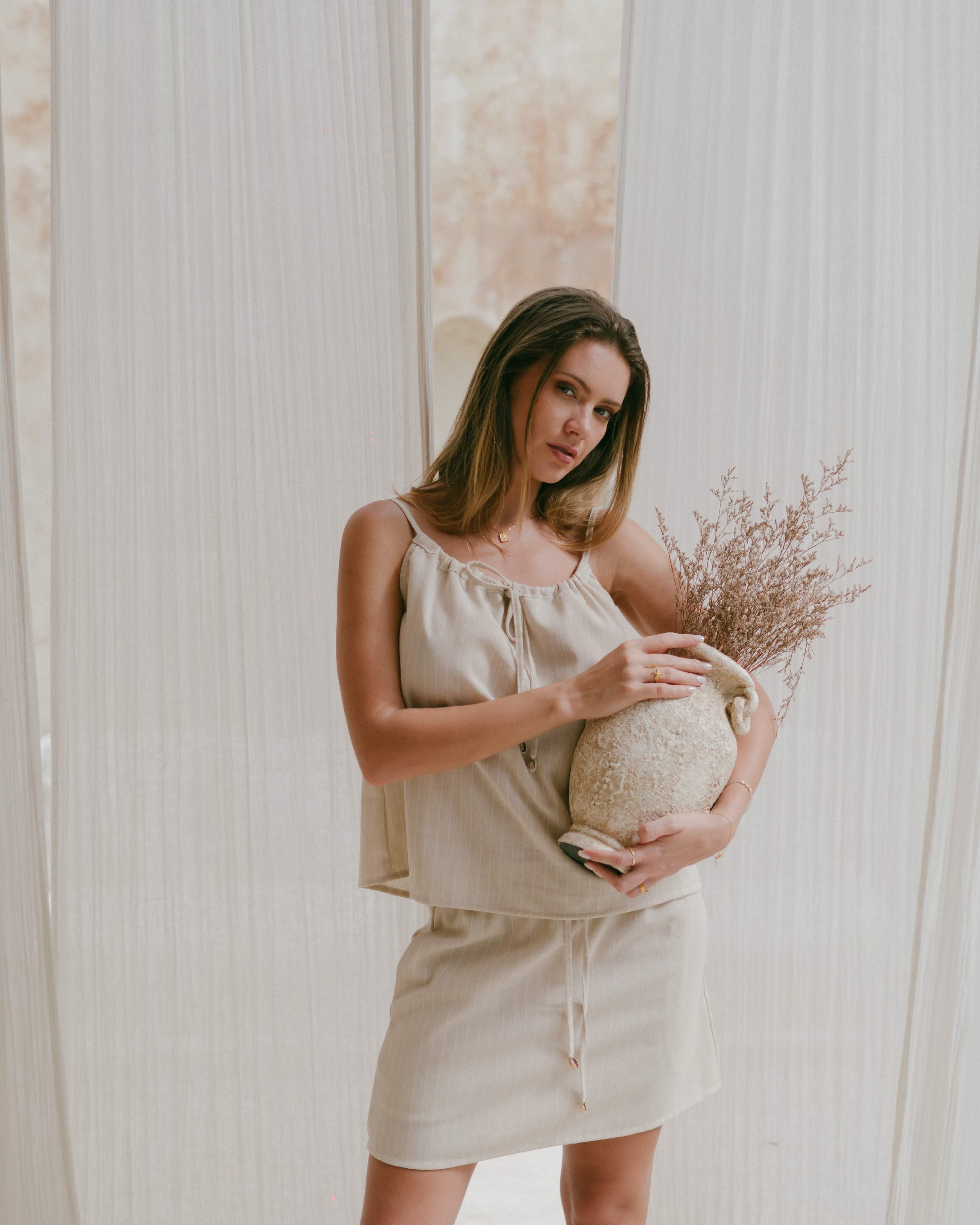 Casual beach singlet top with cowrie shell ties and subtle stripe print for everyday summer wear.