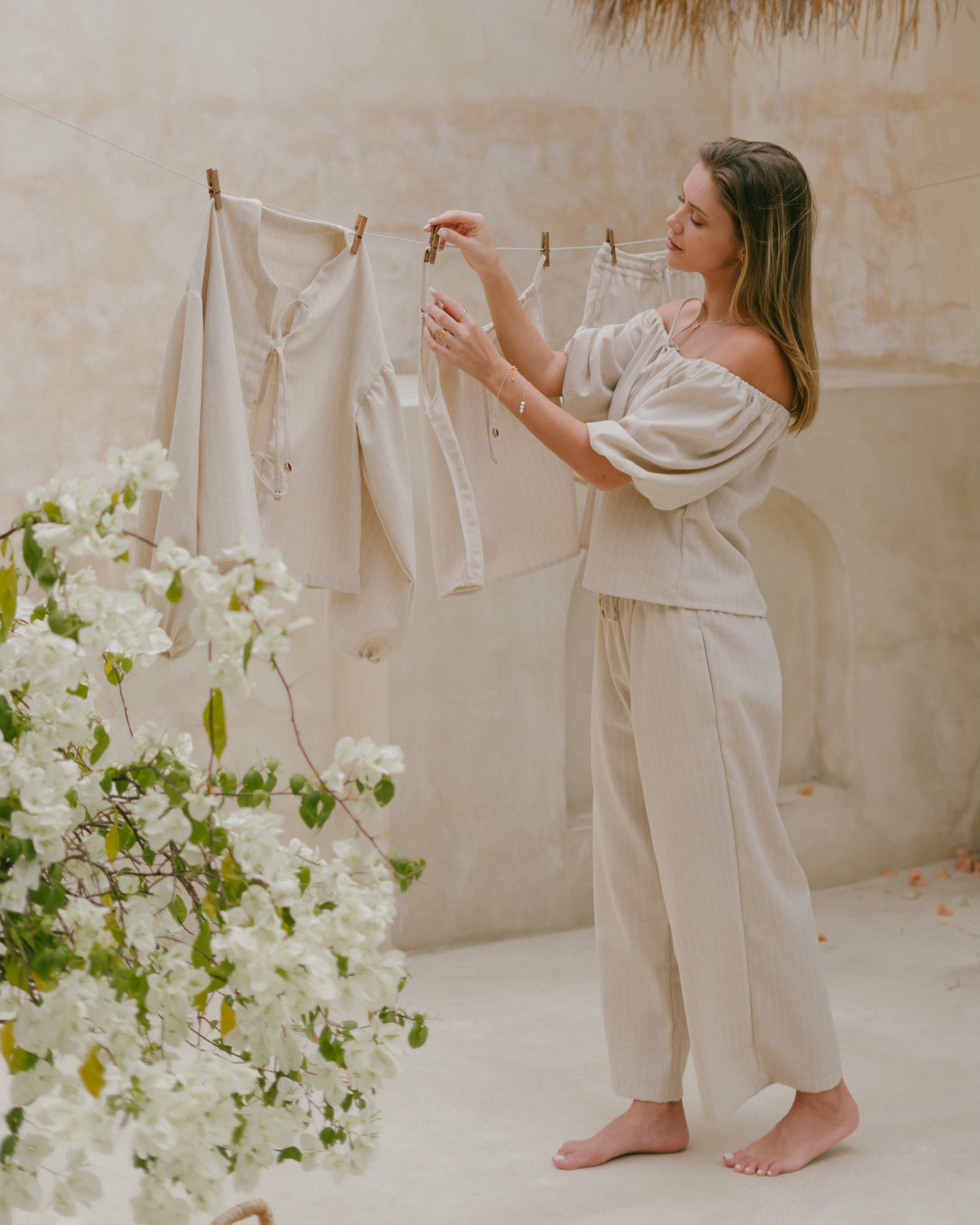 Effortless summer Amalfi wide-leg trousers with adjustable tie-up waist and side seam pockets.