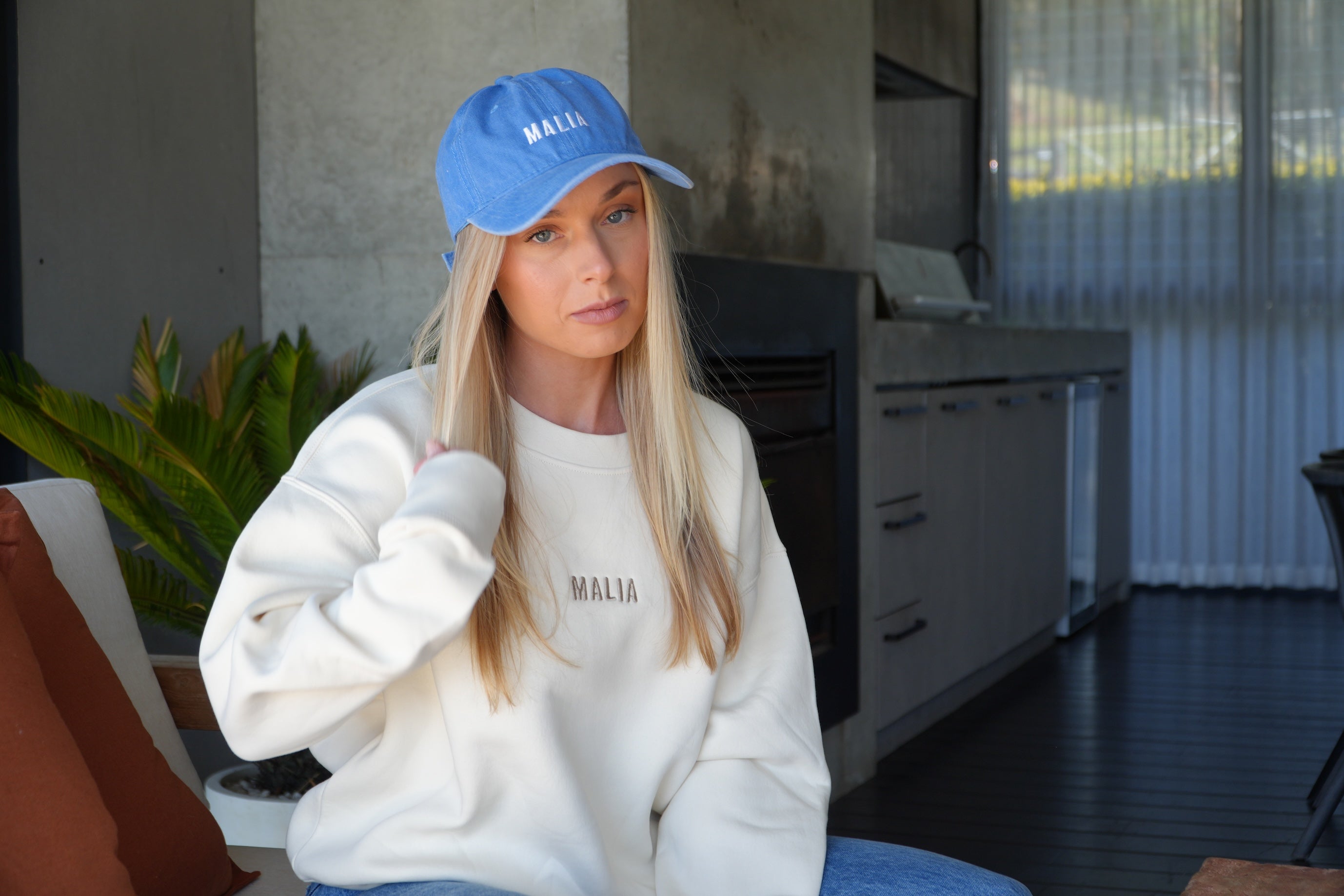 Add laid-back charm to any look with the washed blue Malia cap, designed for comfort and ease.