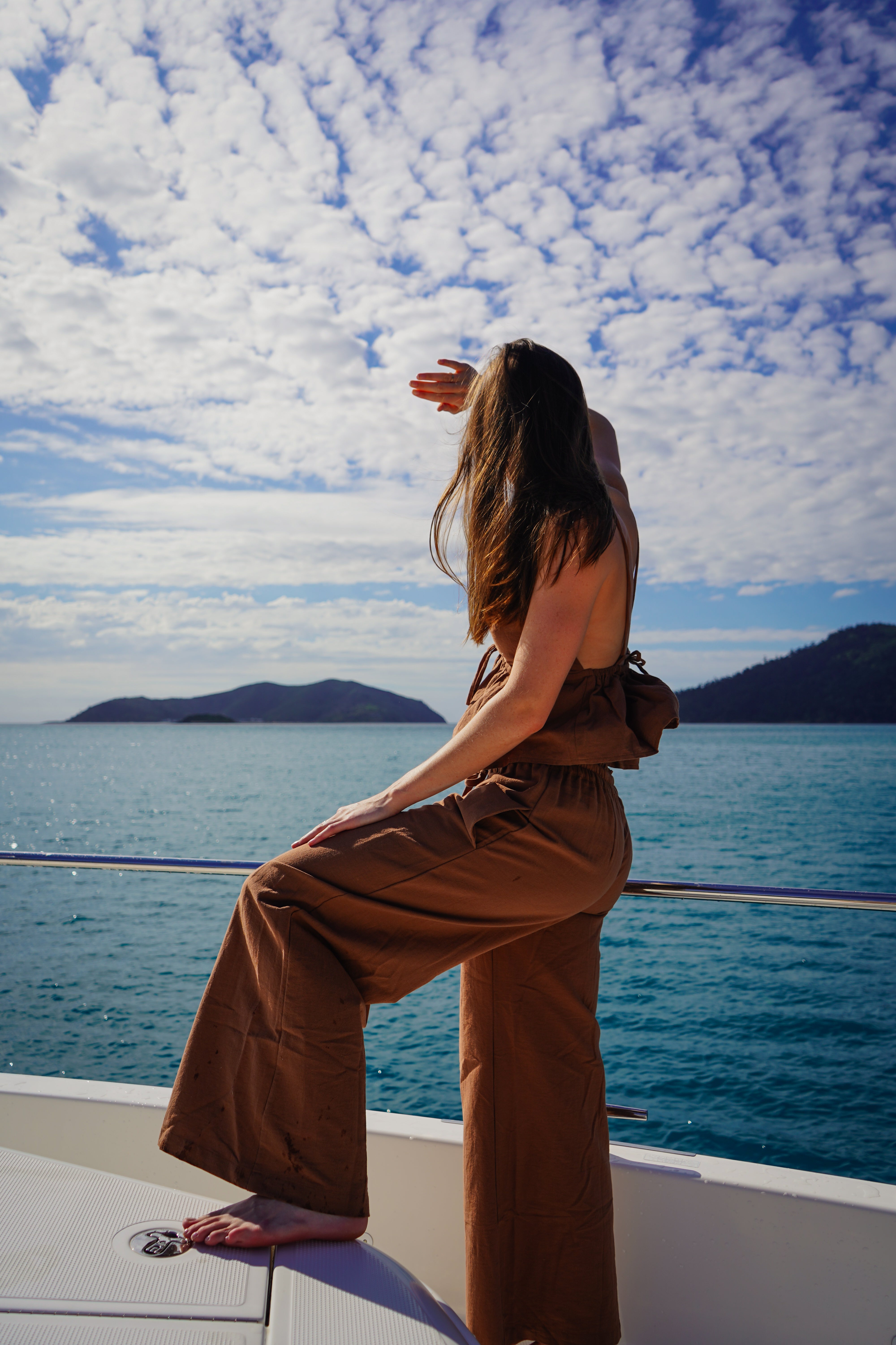 Linen Bamboo pant and top matching set on boat in the Whitsunday islands of Australia. Slow fashion for a better planet by Malia The Label