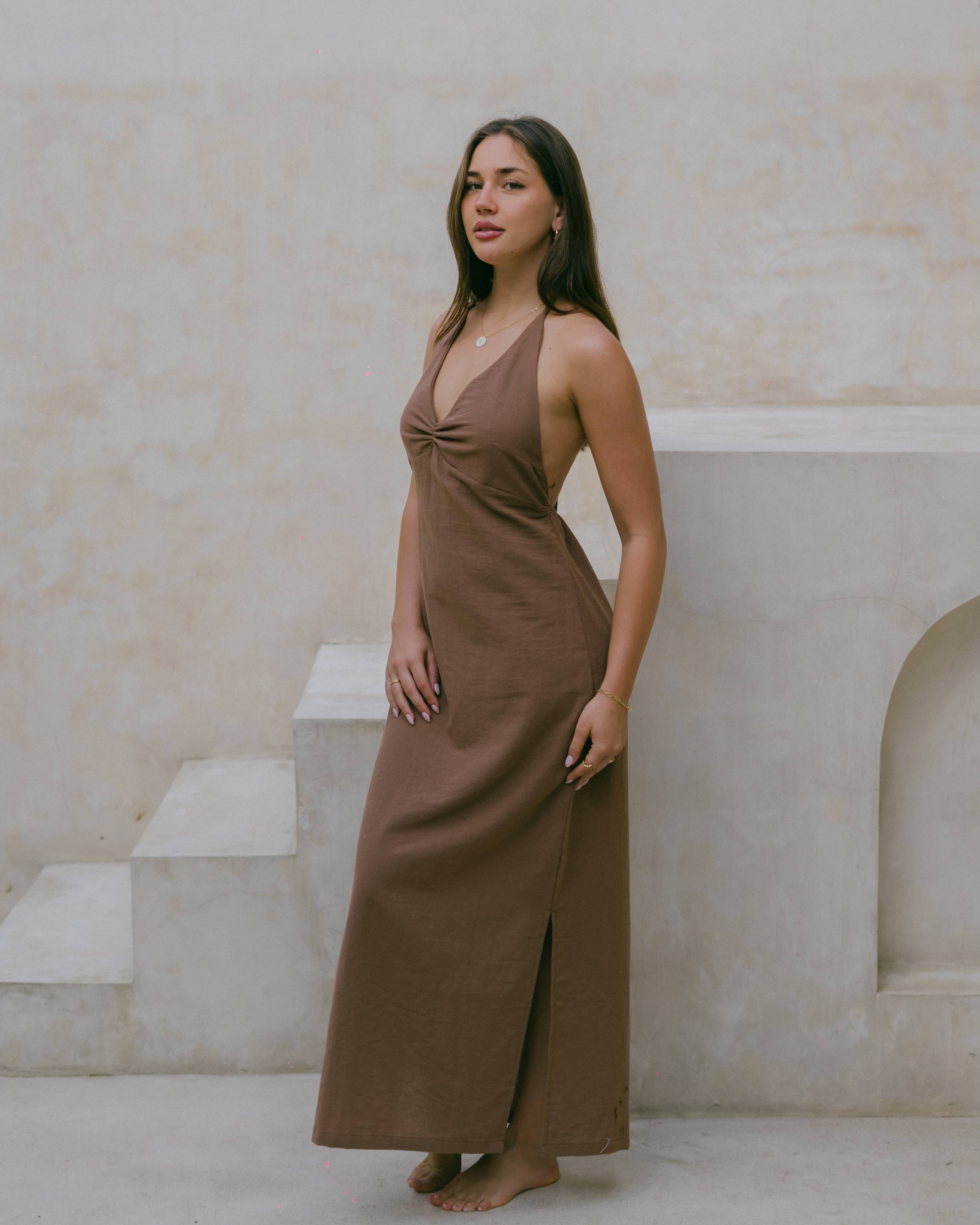 Discover effortless style with the Palma Halter Maxi, a chocolate brown maxi dress made for slow living and golden hour moments.