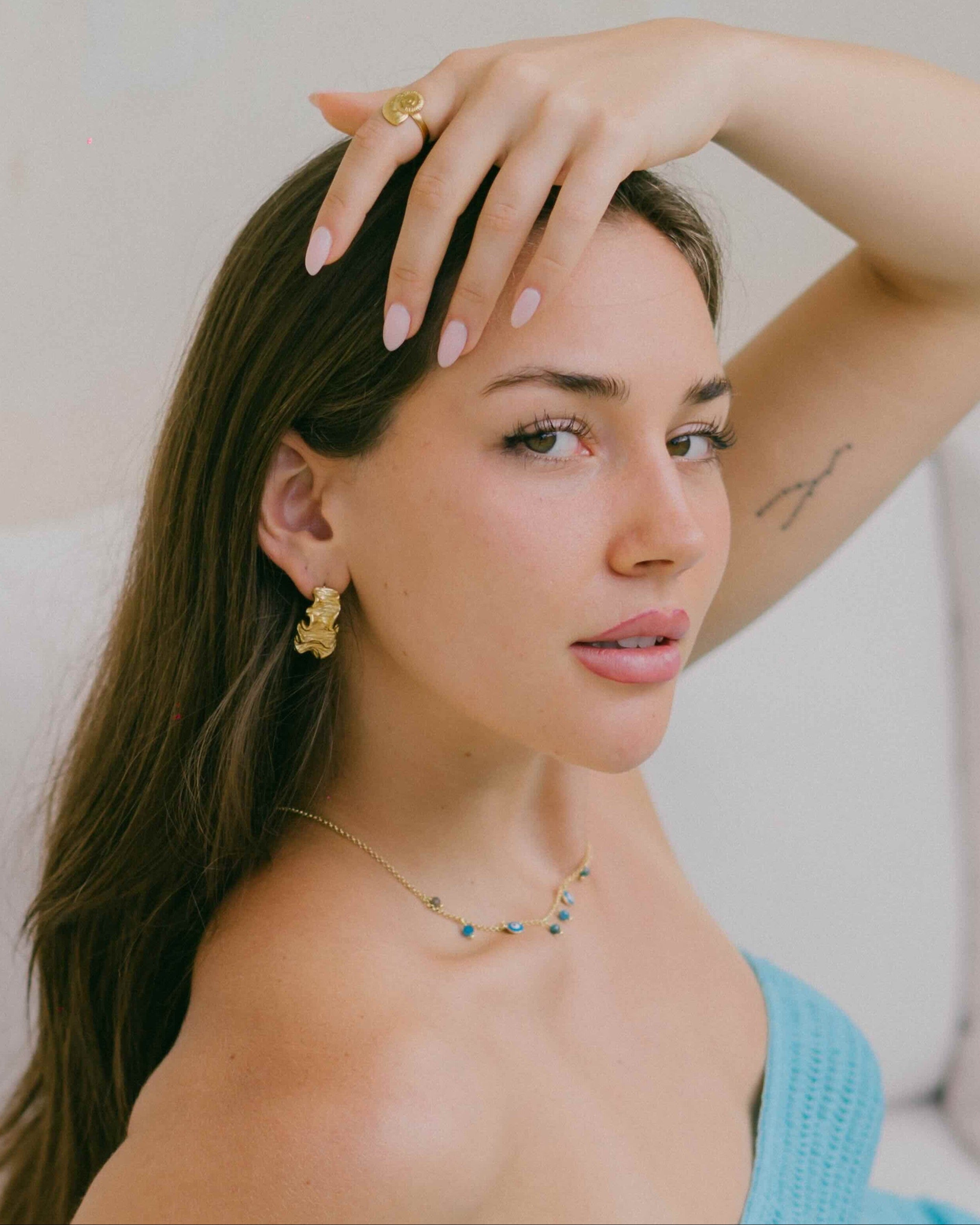 Coral like wavy stud earrings in 18k gold plating. Ocean inspired jewellery by Malia the label.