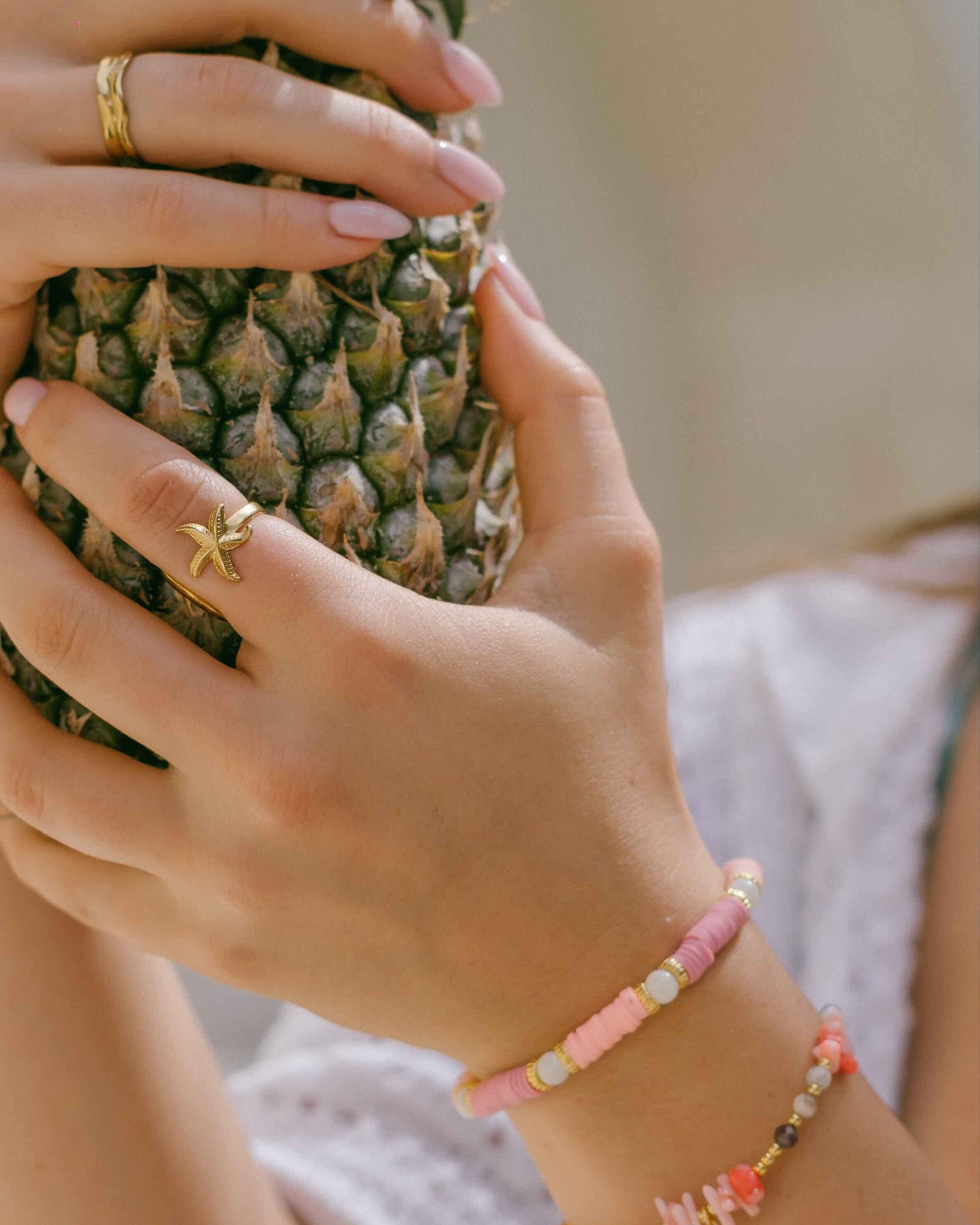 Discover the Coral Rose Bracelet—multi-toned pink stones, gold and crystal beads, and freshwater pearls for a vibrant yet elegant bracelet inspired by coral reefs.