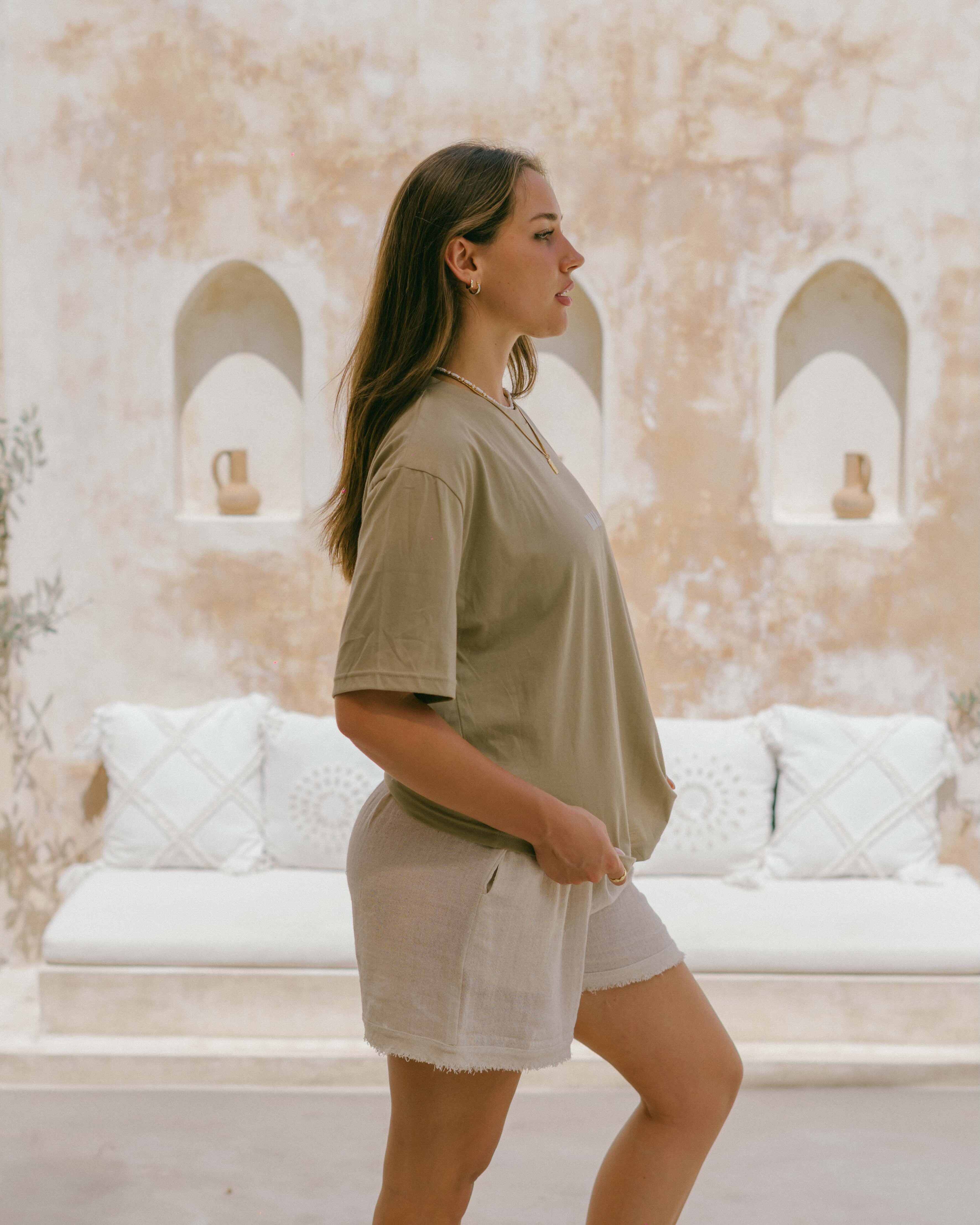 A timeless everyday essential, this eco-friendly tee offers relaxed comfort and a coastal motif reminding you to slow down and breathe.