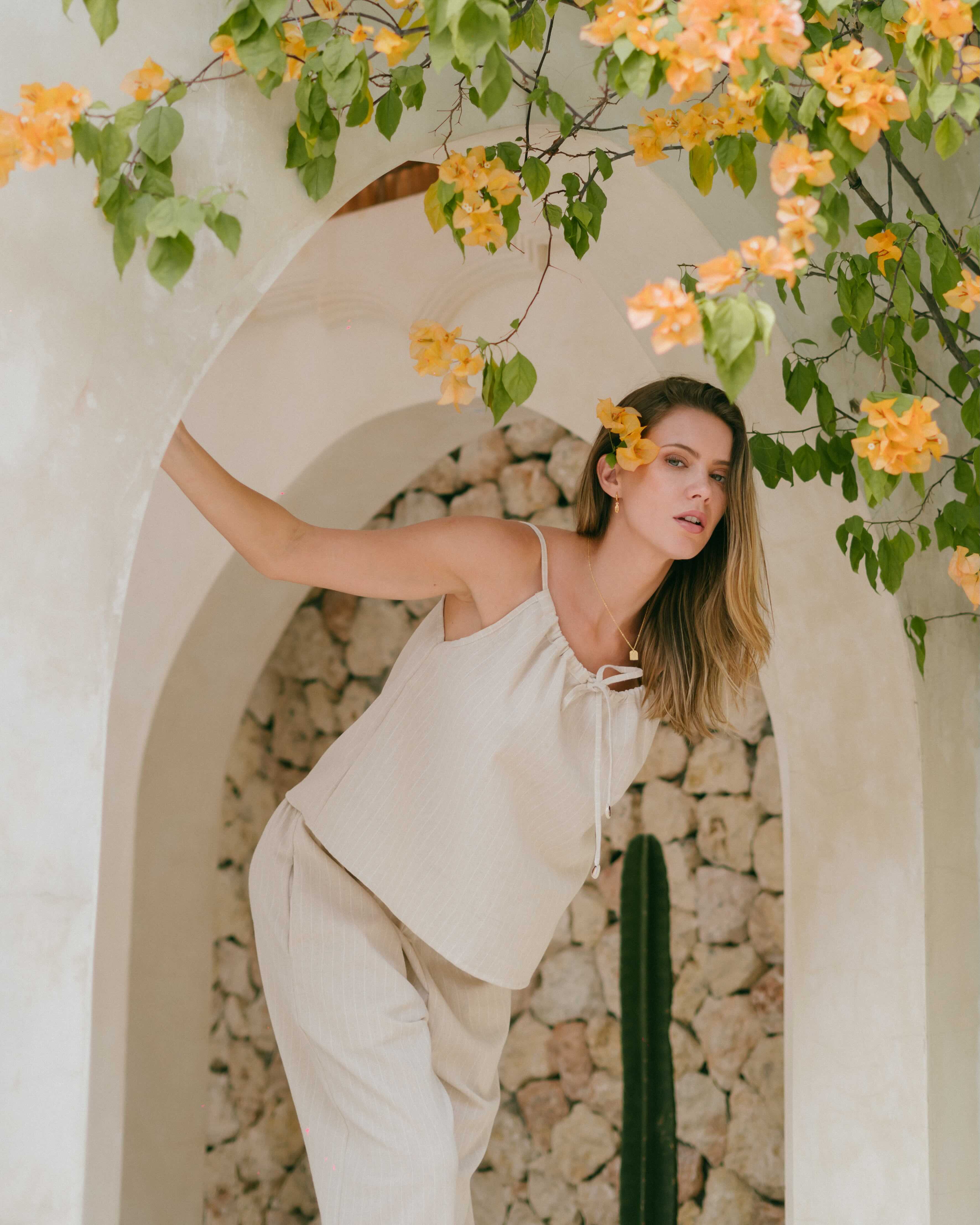 Luma Top – singlet-style summer top with adjustable tie-up front and cowrie shell detailing.