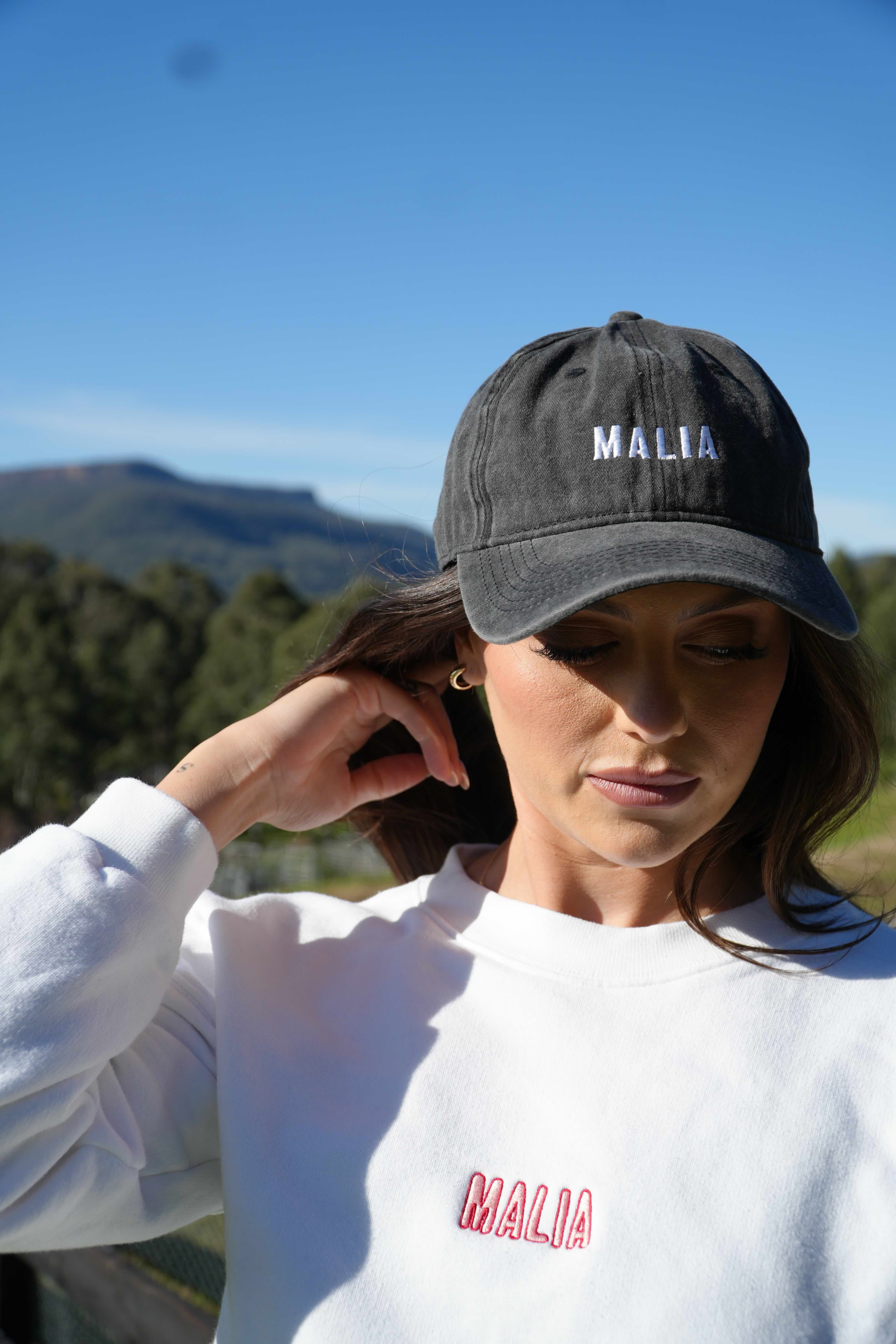 Stay sun-ready in the Malia Charcoal Washed Cap, featuring a relaxed, lived-in finish and embroidered logo.