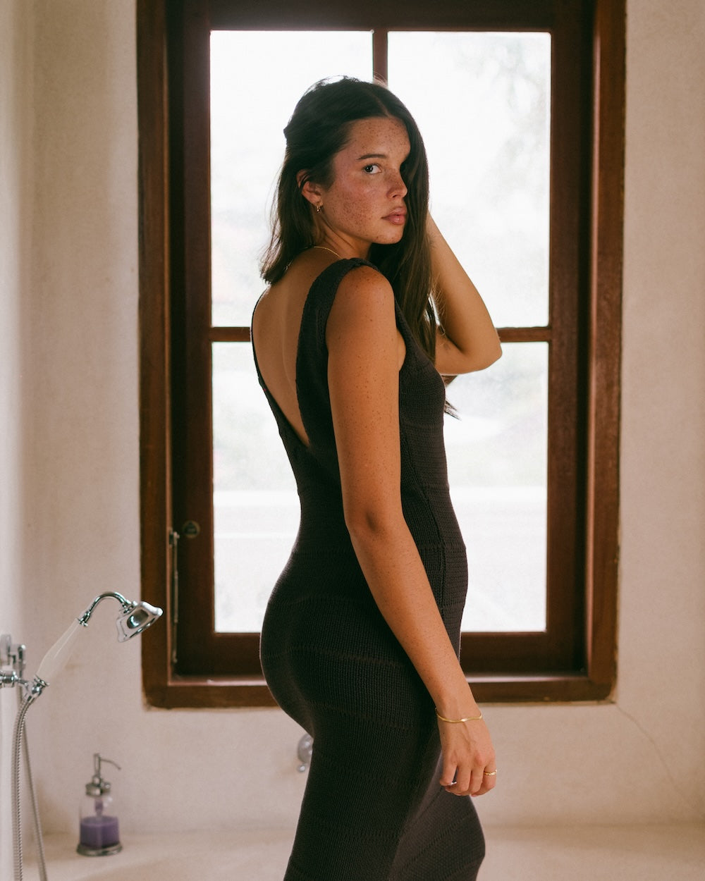 Noa Knit dress in rich chocolate hue, detailed with horizontal knit details. Handcrafted from 100% cotton, detailed with a V-neck front and back.
