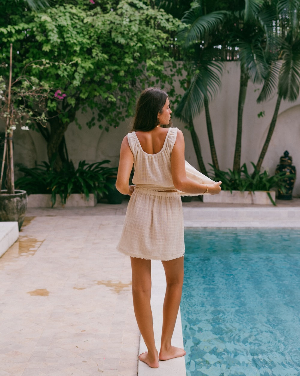 Sofia top and mini skirt co-ord matching set - 80% ramie, 20% cotton with check fabric textured matching summer set - shown from behind with curved neckline singlet top and mini frayed edge skirt - Malia the label, Ausralian slow fashion brand