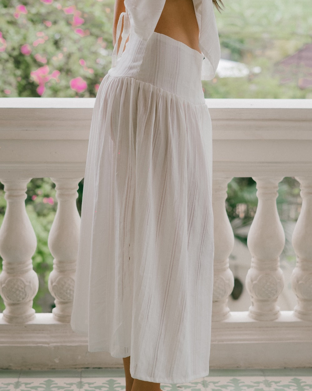 Sole Mare Maxi Skirt - Side view featuring flush waistband structured to hips and gathers to create a floy white maxi skirt that hangs to floor length - Malia the label - Slow fashion brand