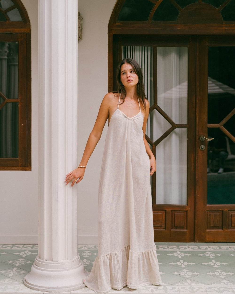 Vela Maxi Dress in natural cream — full length floor-sweeping silhouette with ruffled hem and convertible braided v-neckline — 80% ramie 20% cotton — Malia The Label — natural fibre maxi dress Australia