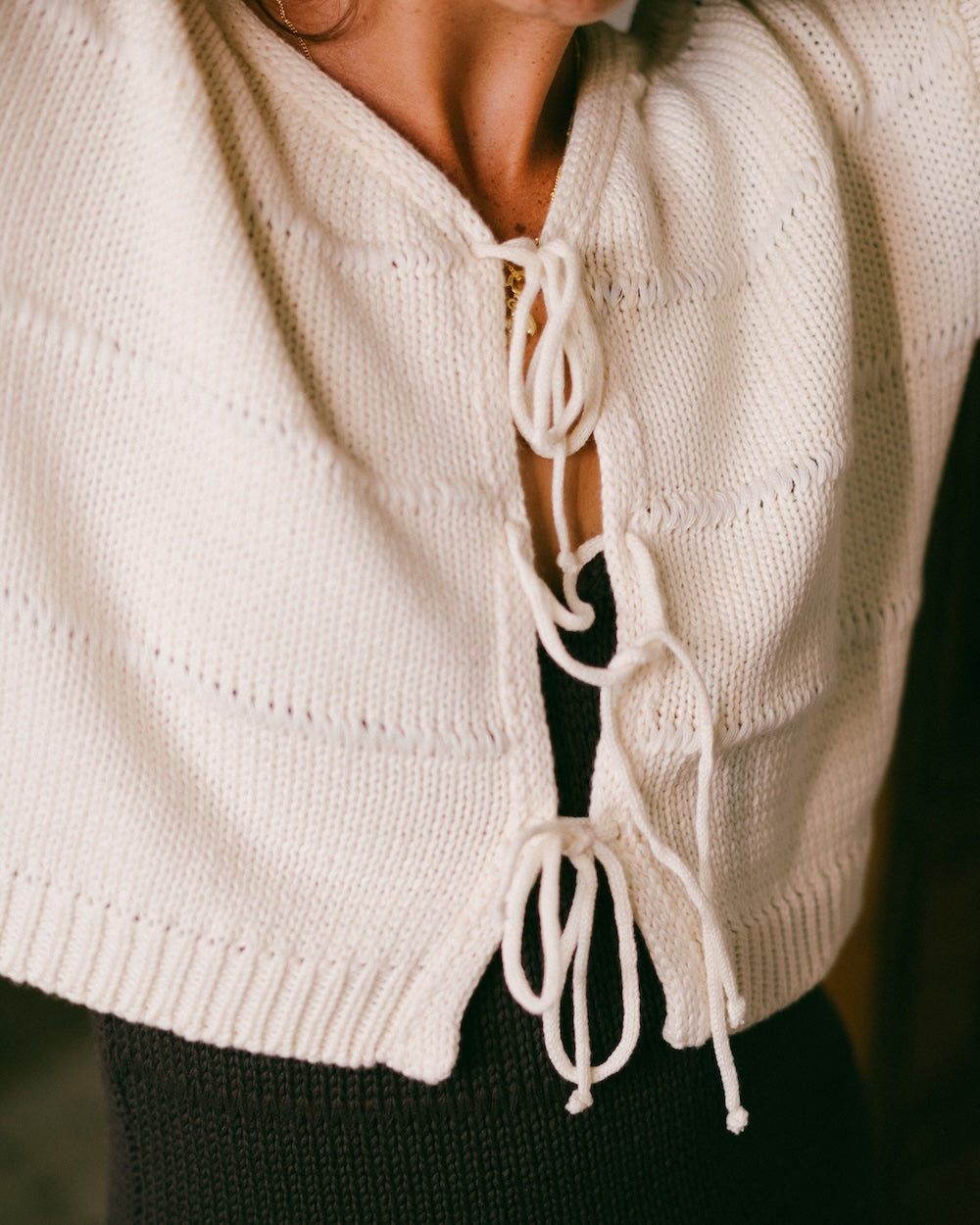 Winnie Knit jumper in white up close featuring 3 tie up front details - 100% cotton knit cardigan by Malia the label